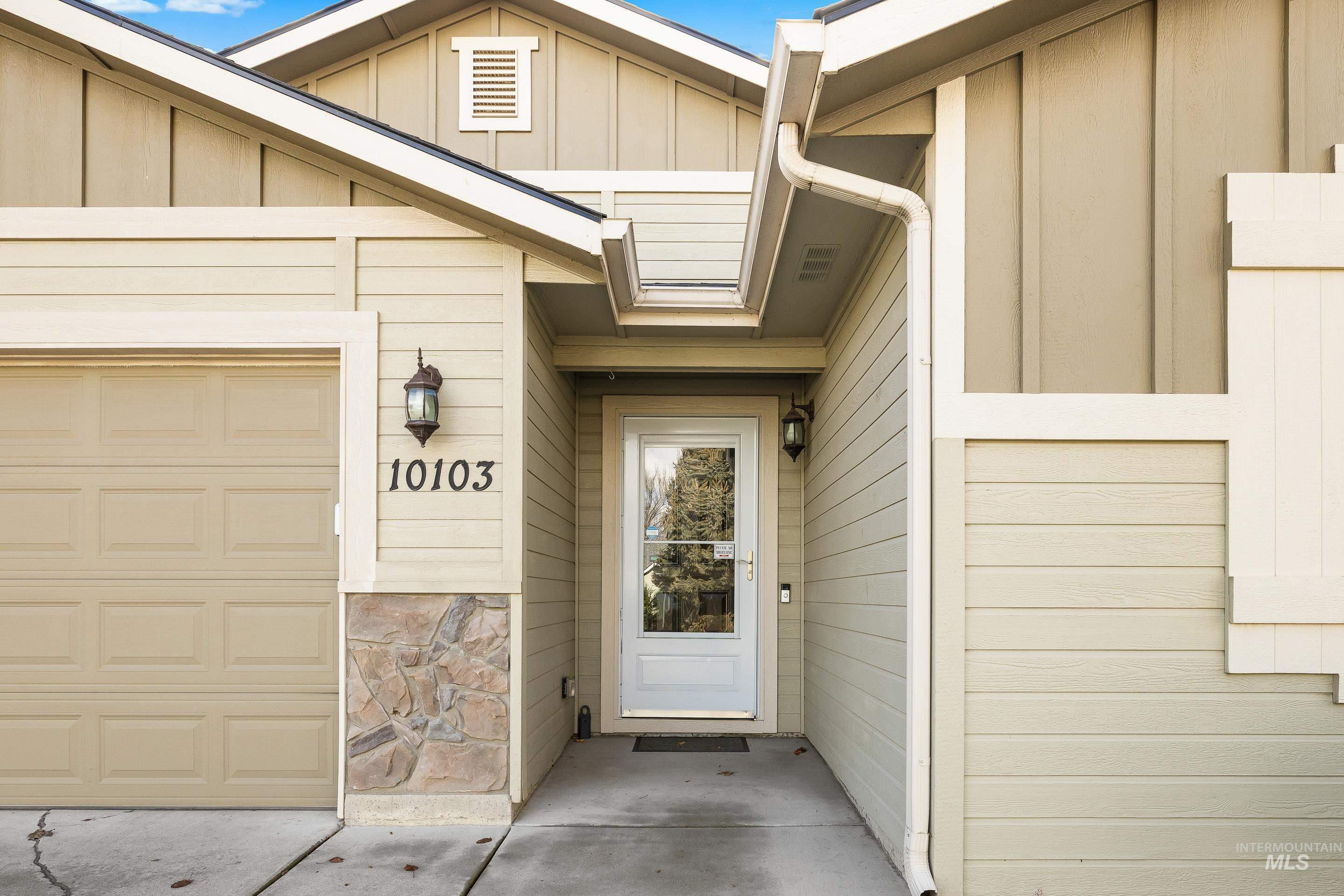 Entrance to property with board and batten siding
