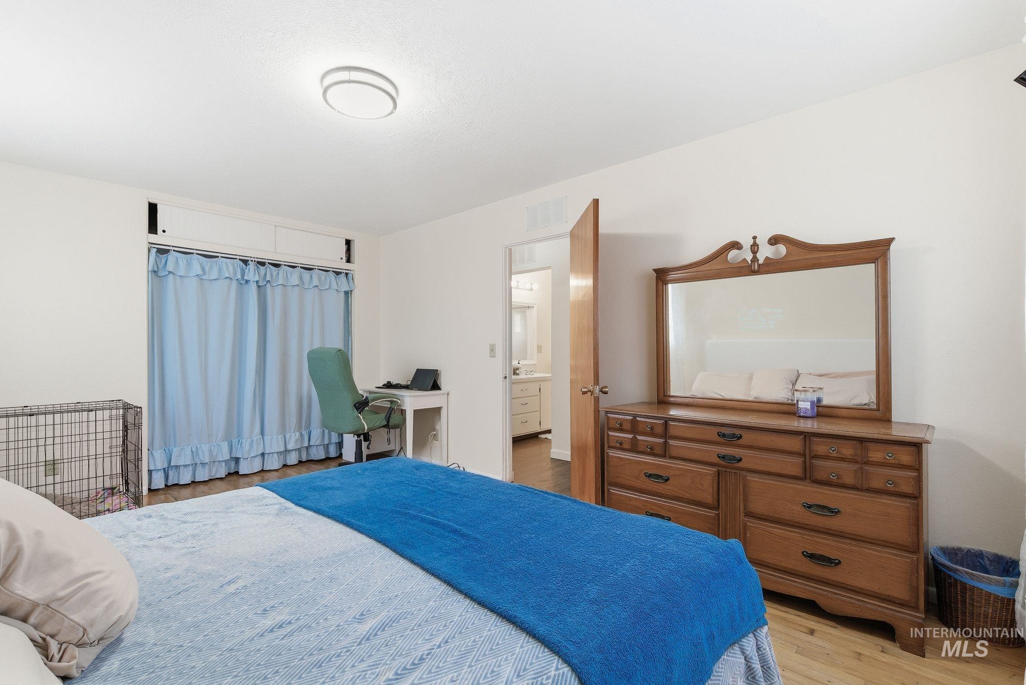 Bedroom with light wood finished floors