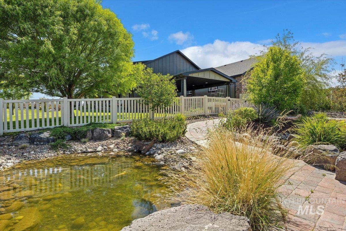 View of yard with a garden pond