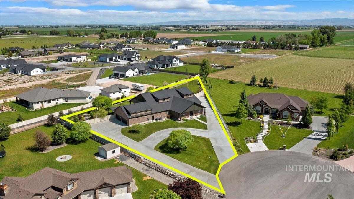 Aerial view of residential area featuring property parcel outlined