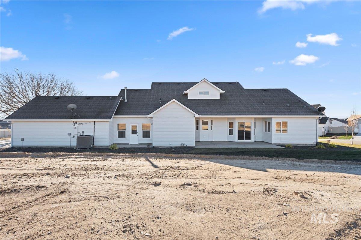 Rear view of property with a patio