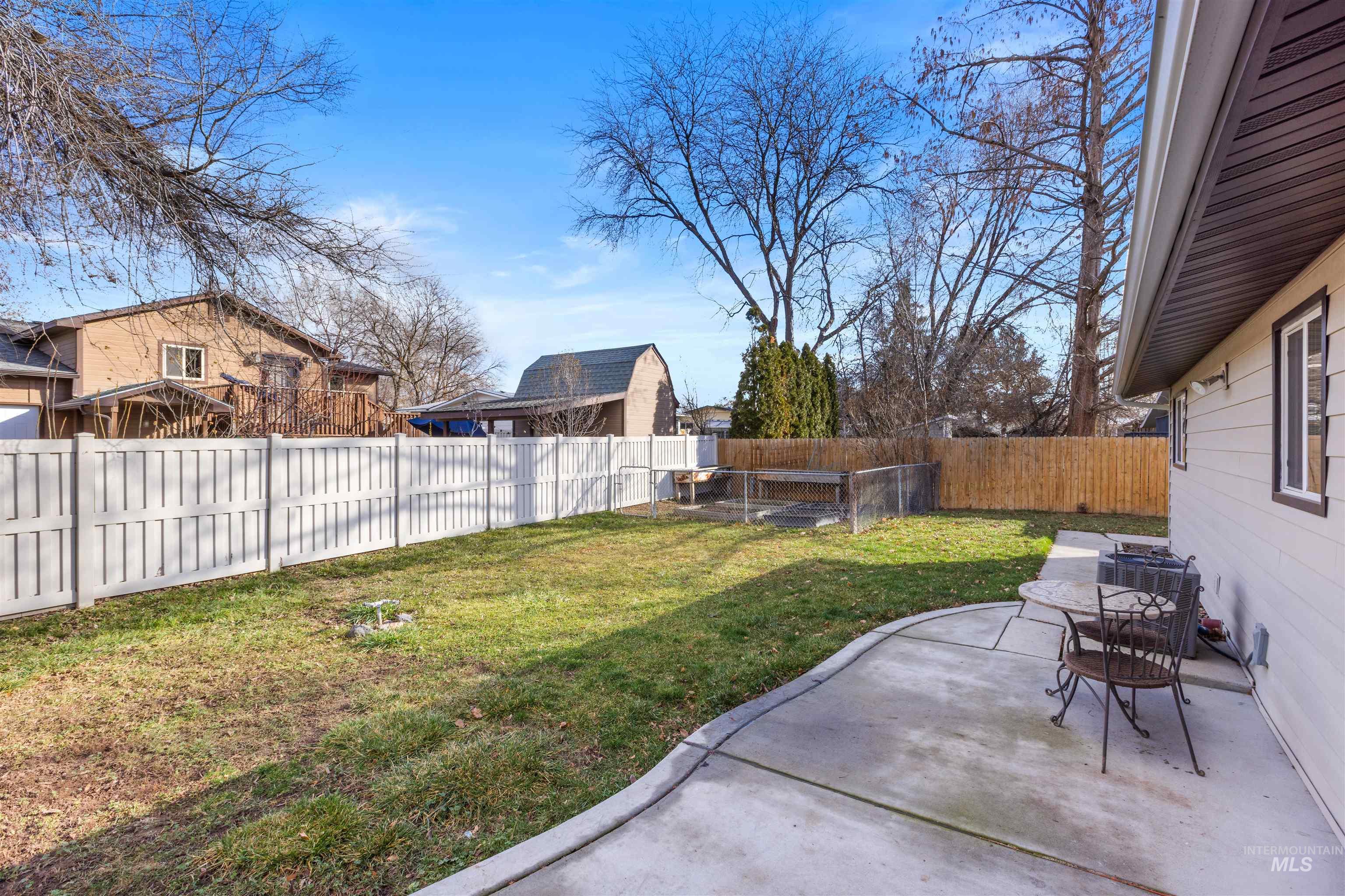 Fenced backyard featuring a patio