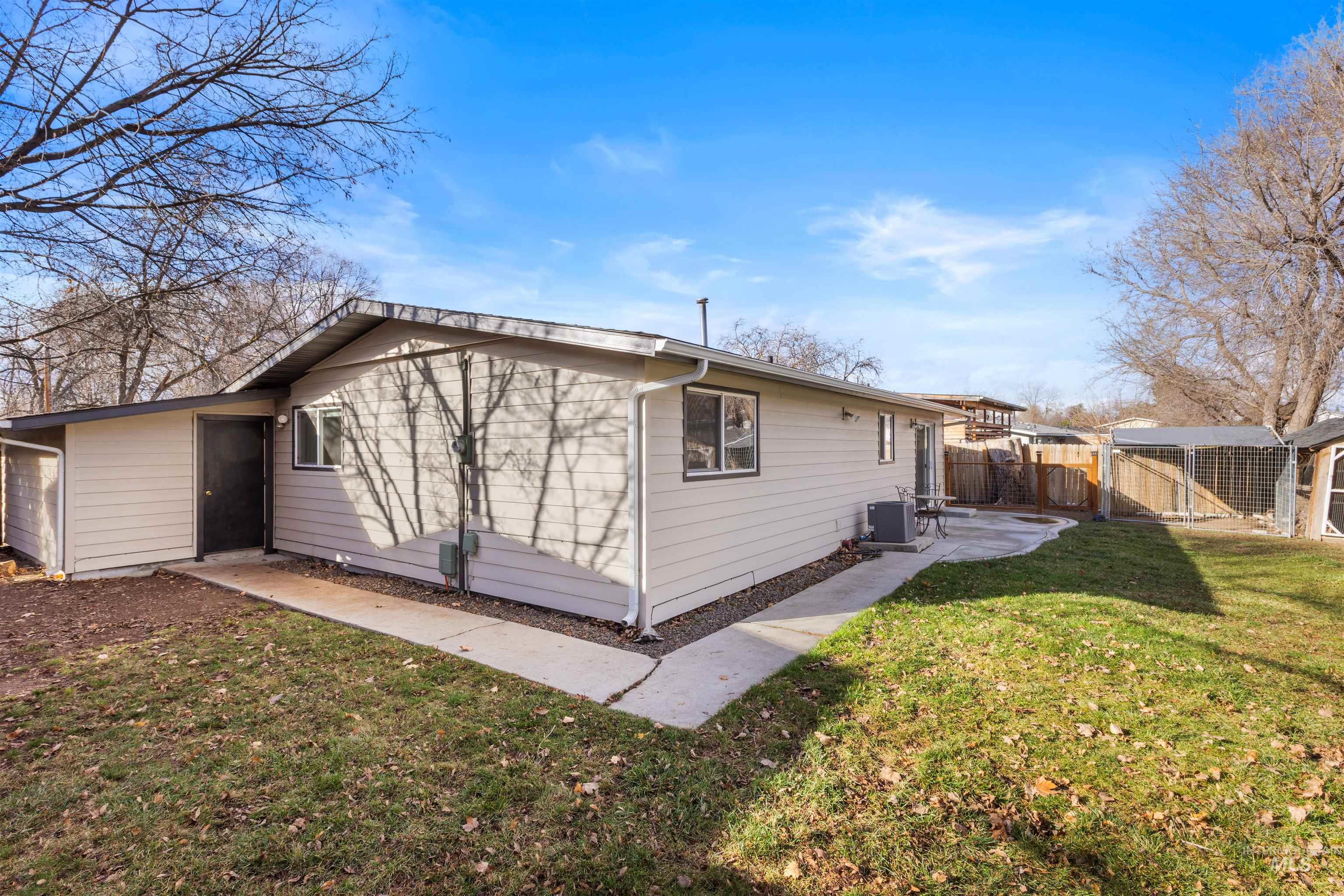 Rear view of house with a patio area