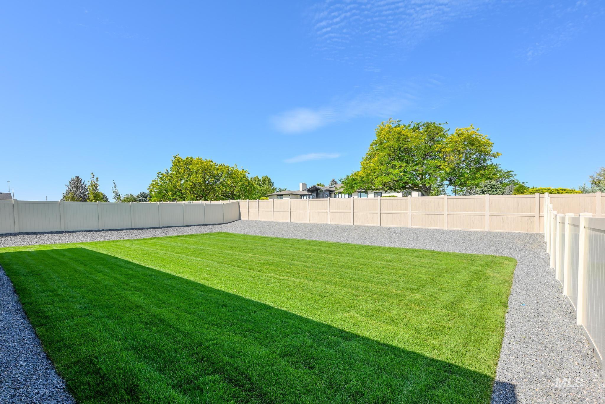 View of fenced backyard
