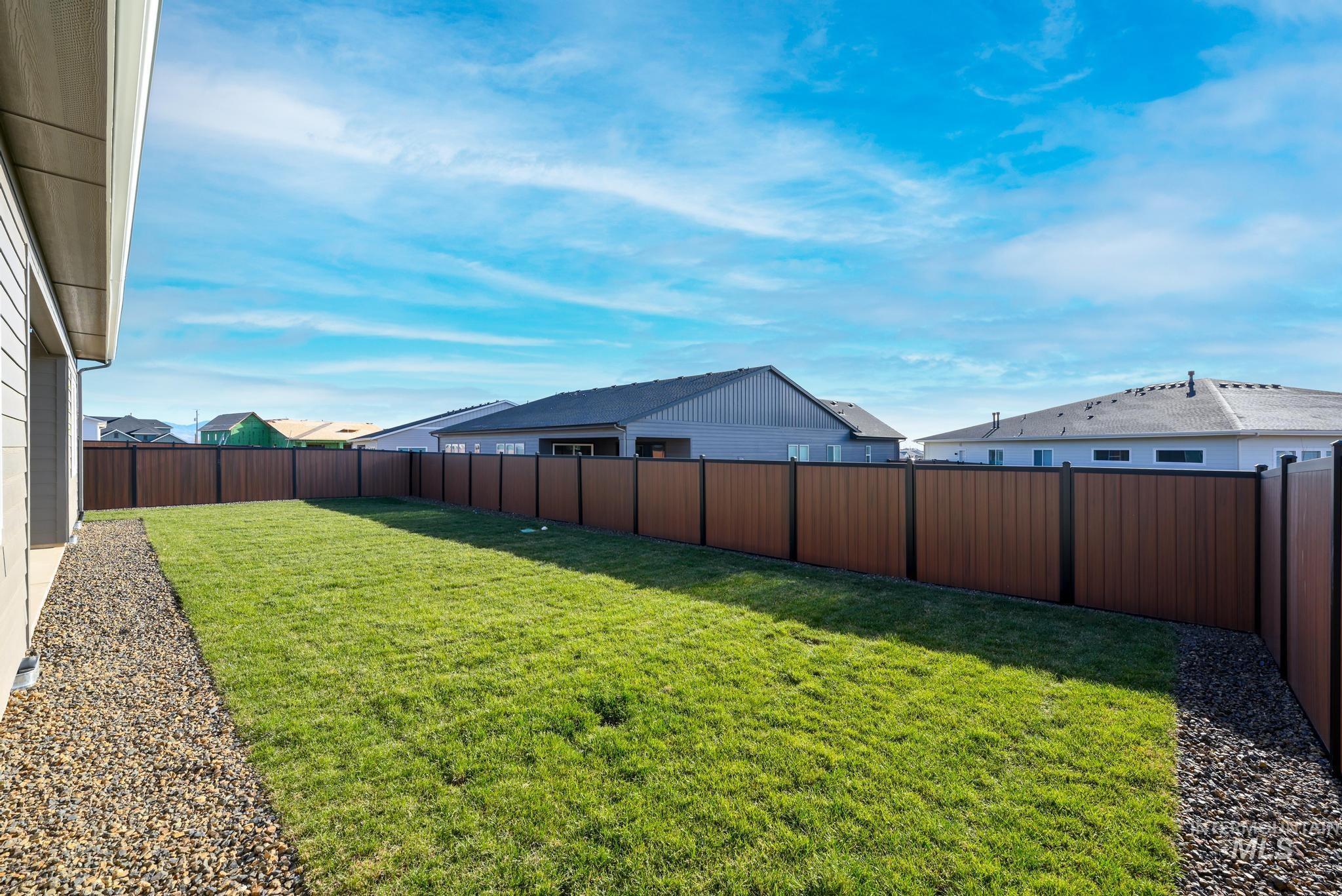 View of fenced backyard