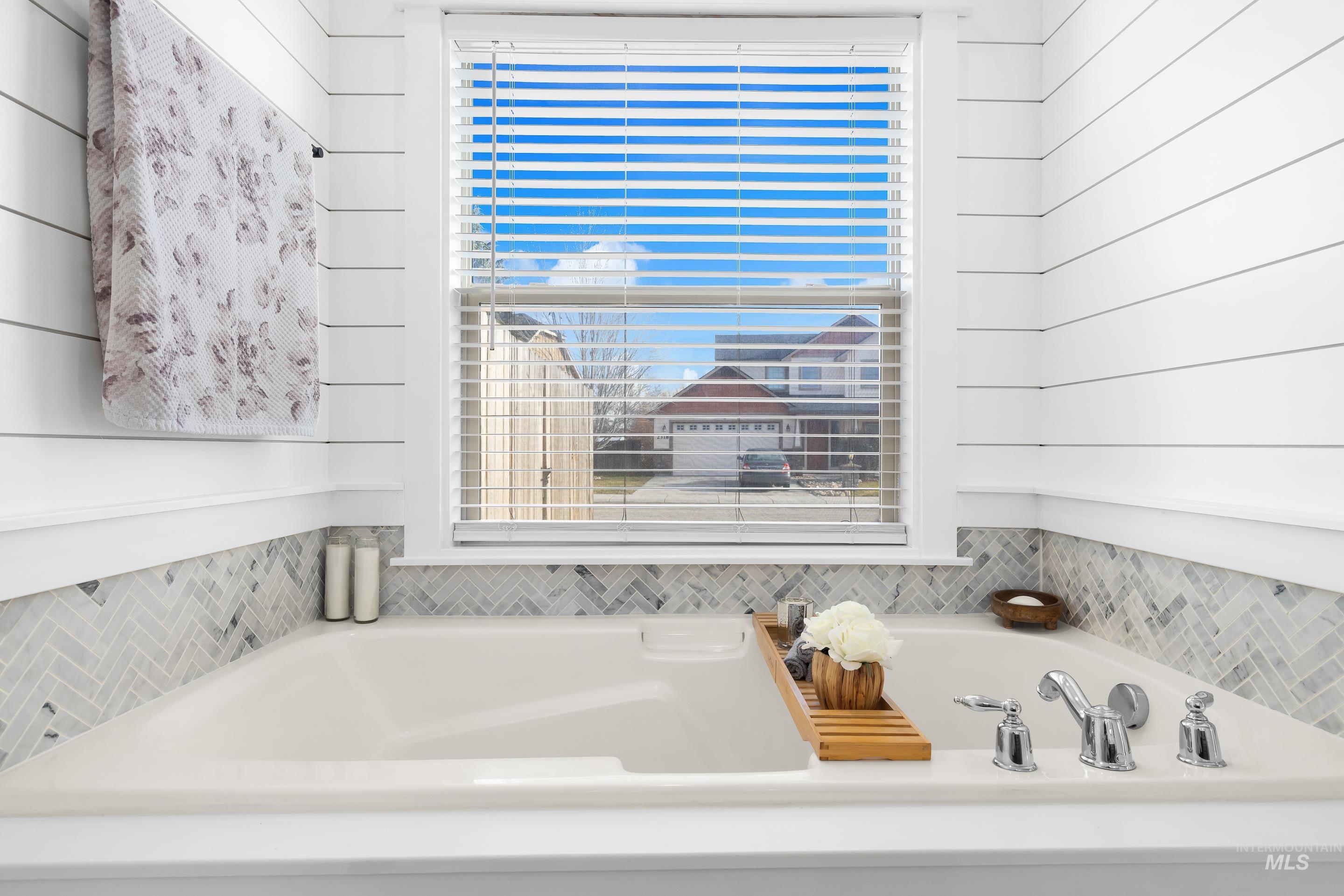 Full bathroom with a garden tub