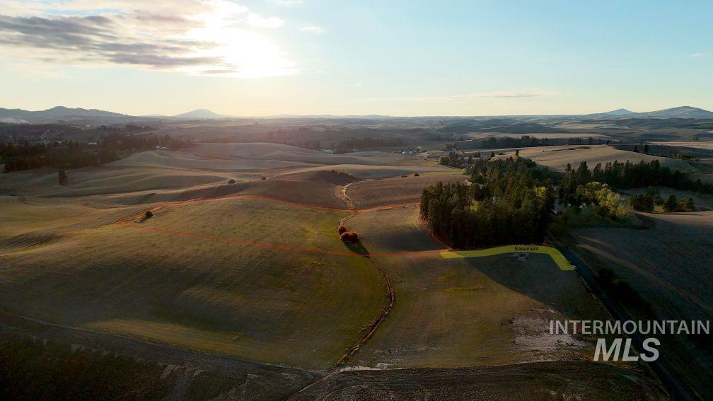 Aerial view at dusk of a mountain view and a rural view