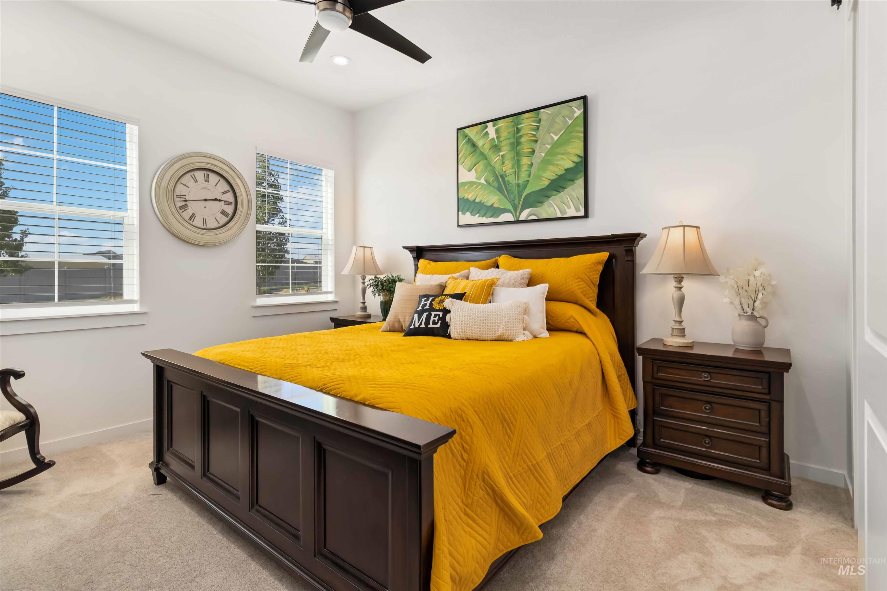 Primary Bedroom with light carpet, a ceiling fan, and recessed lighting. Barn door leading into Ensuite