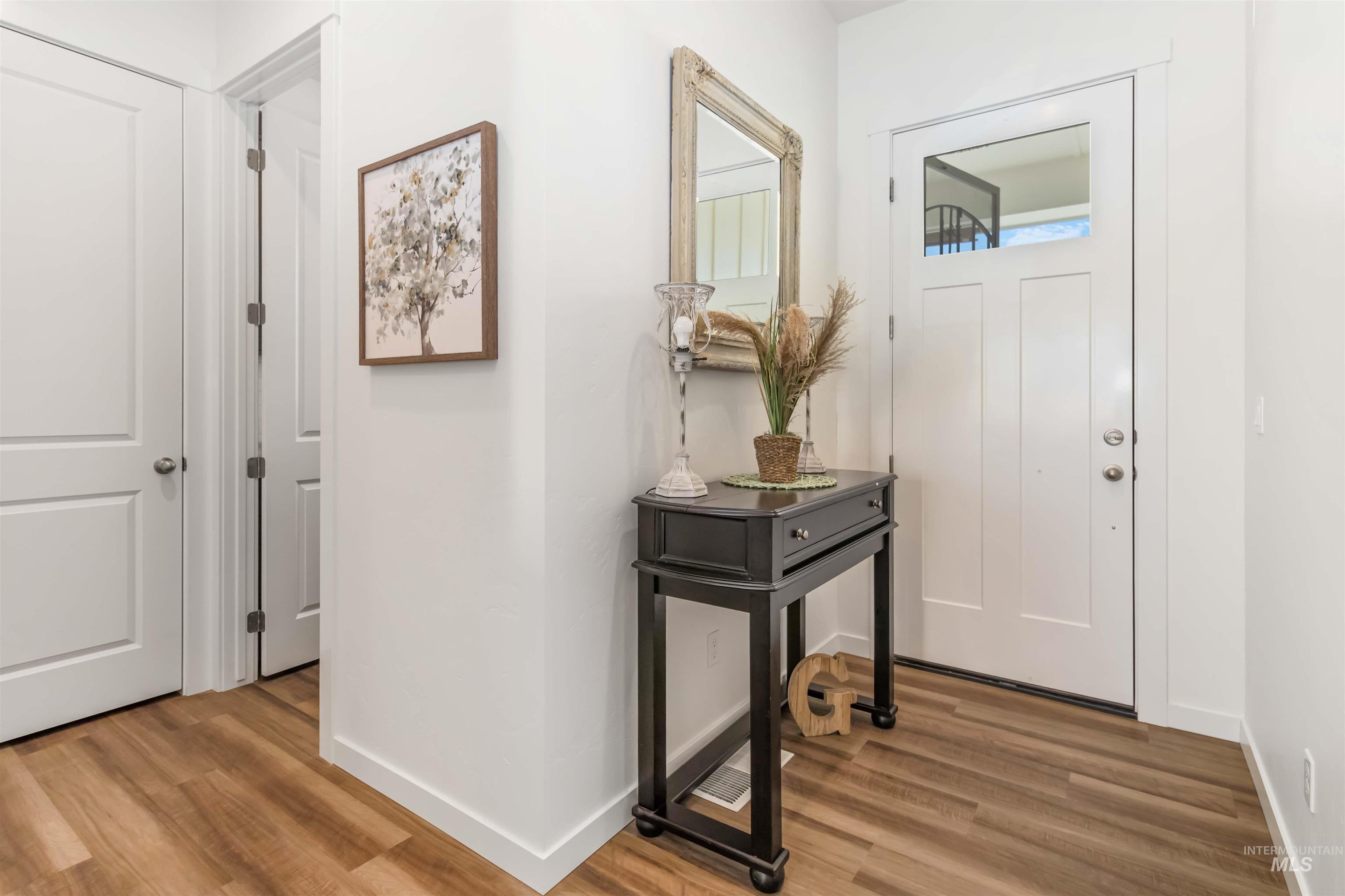 Foyer featuring light wood-style flooring