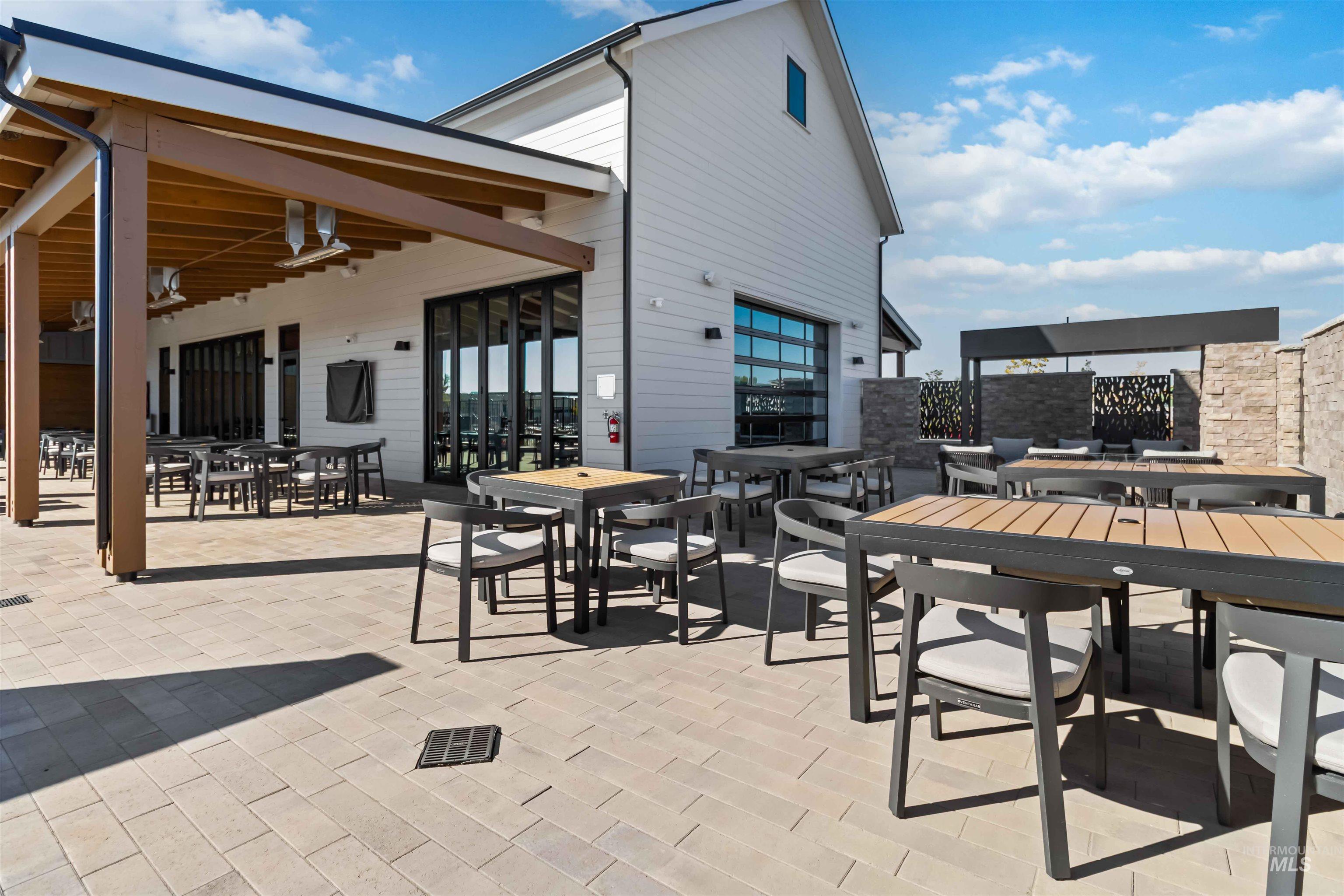 View of club house terrace featuring outdoor BBQ dining area