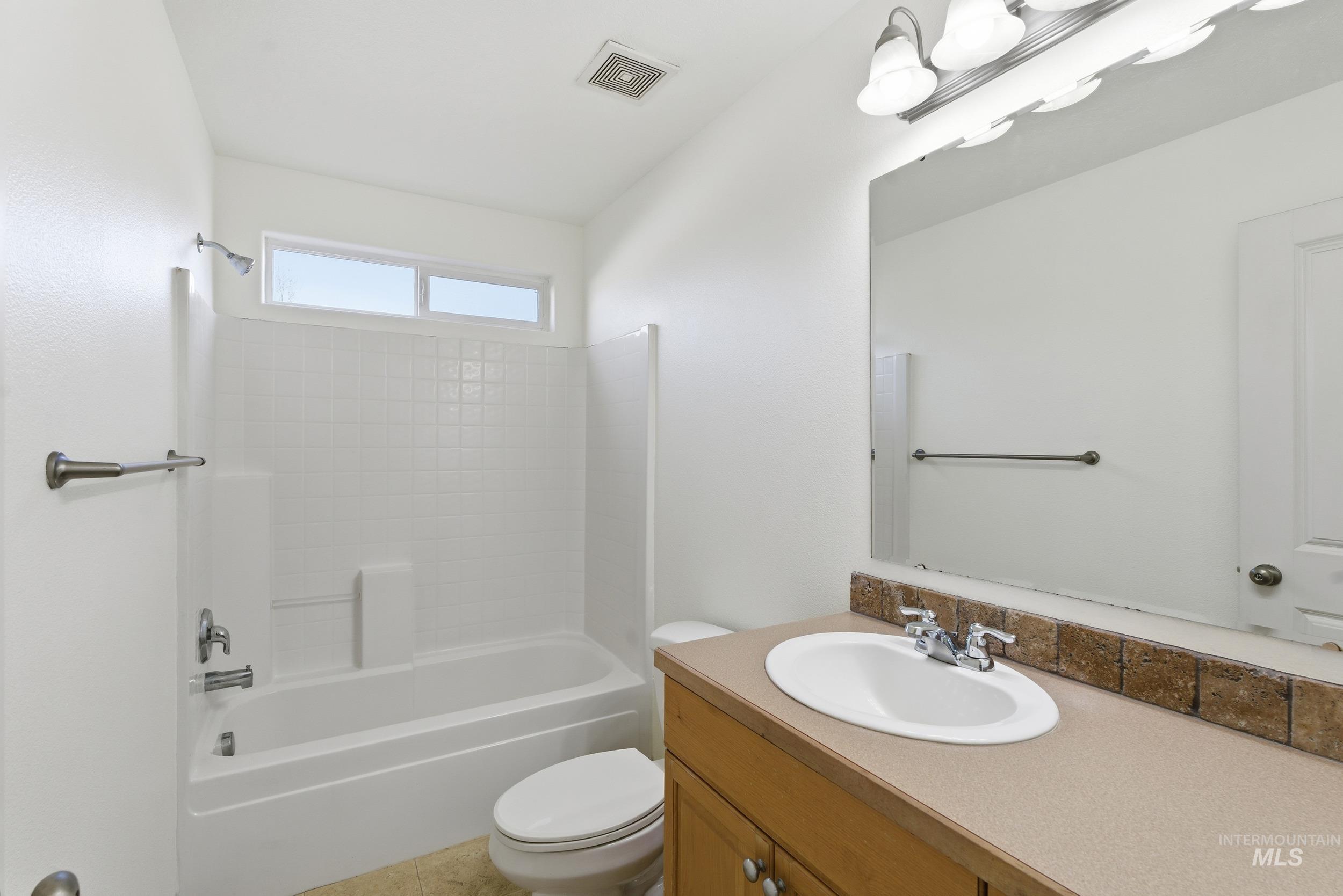 Full bathroom featuring  shower combination and vanity