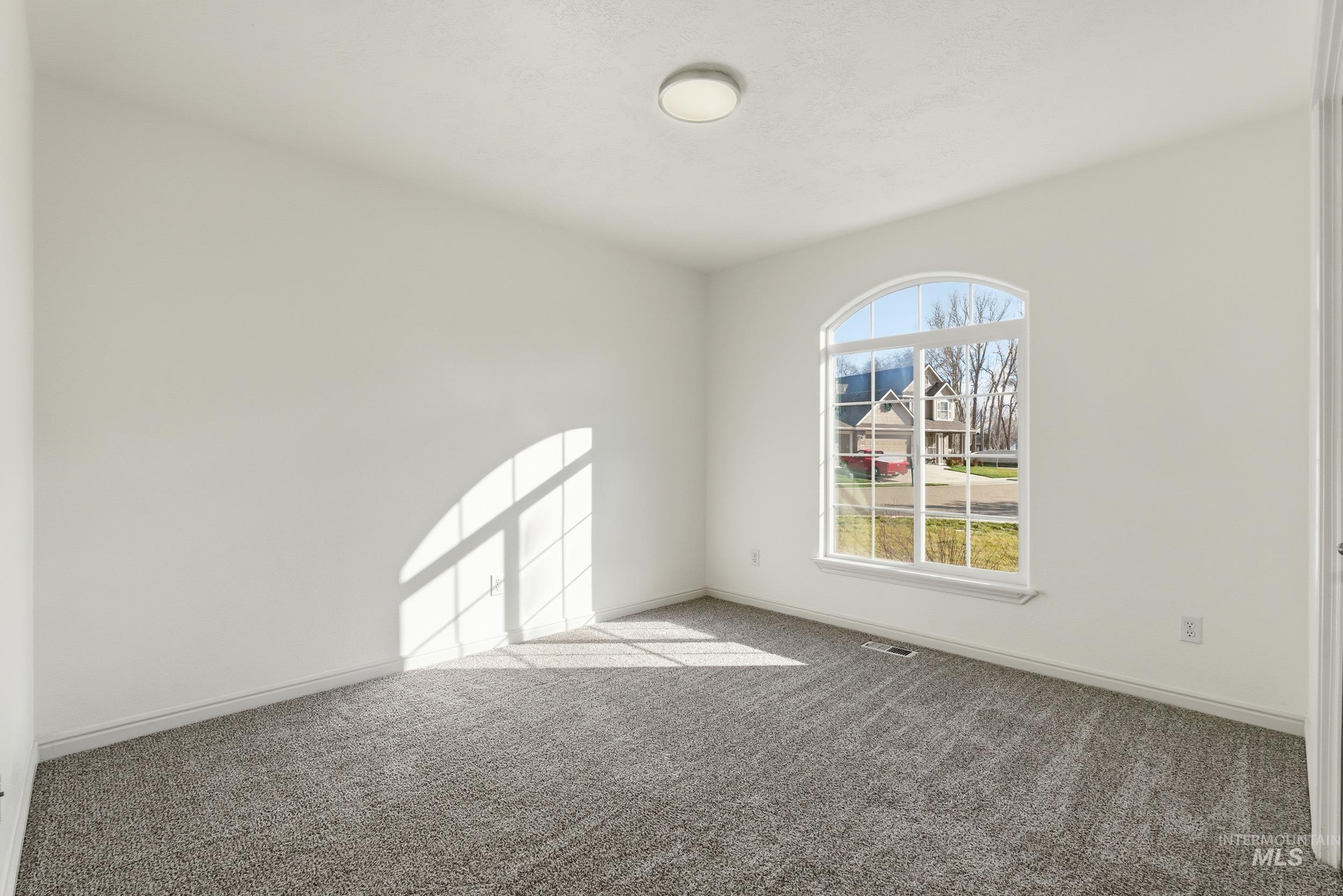 Unfurnished room with carpet and baseboards