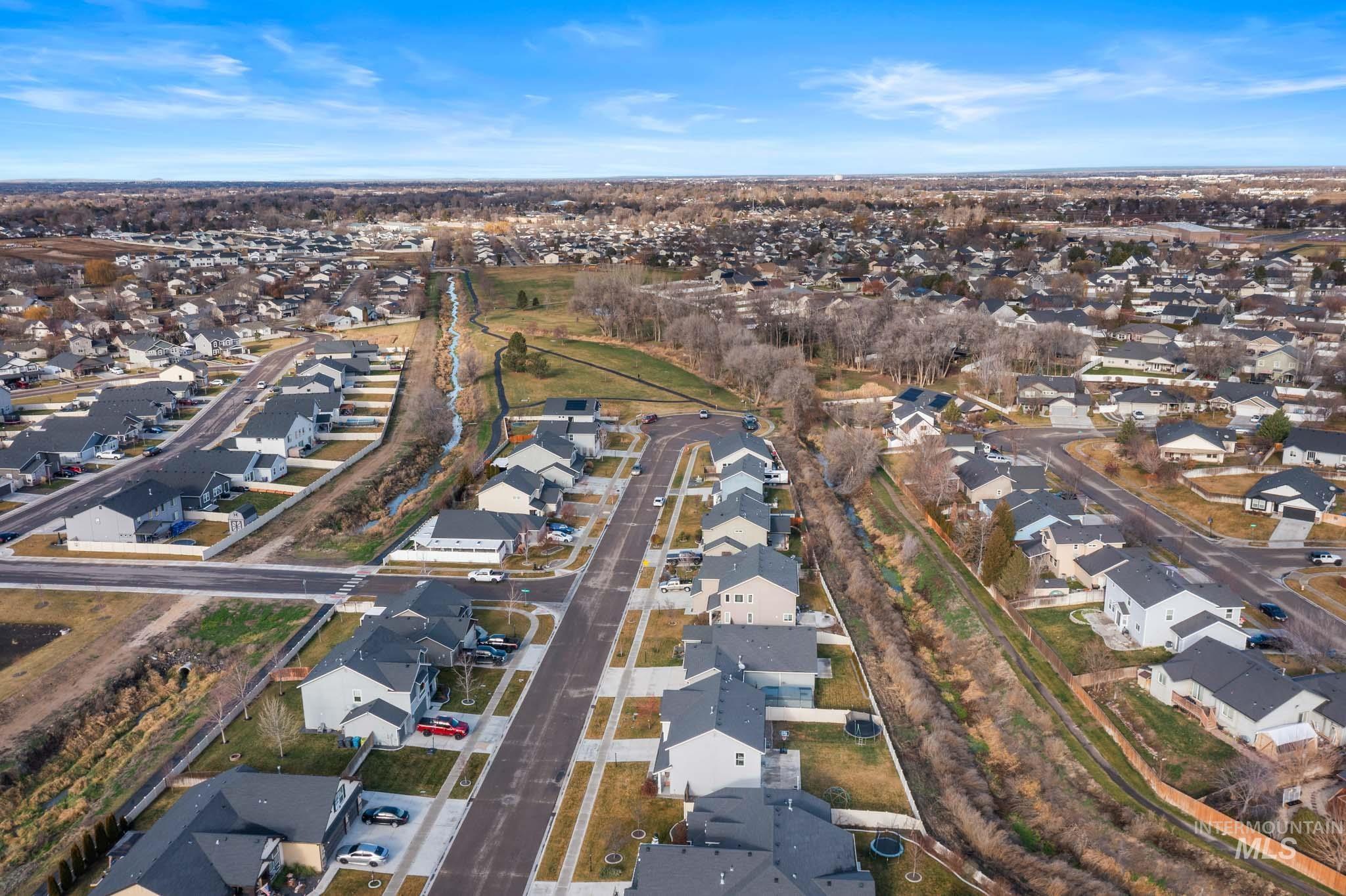 View of property location with nearby suburban area