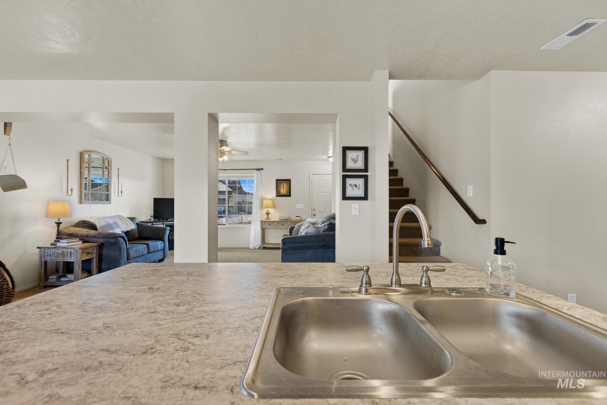 Kitchen with open floor plan and light countertops