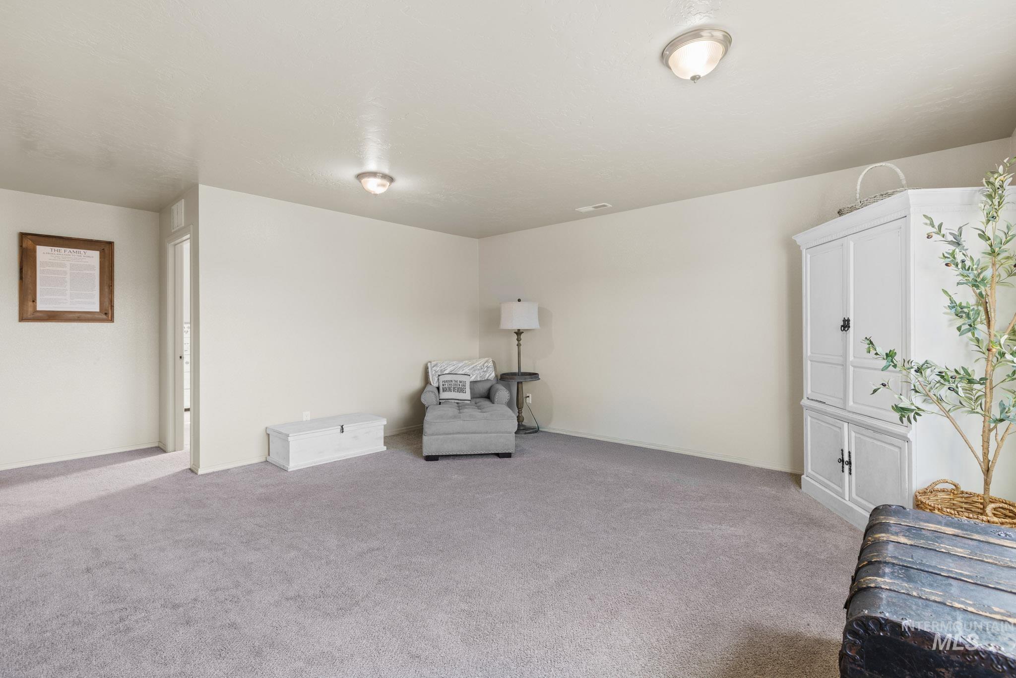 Unfurnished room with light colored carpet