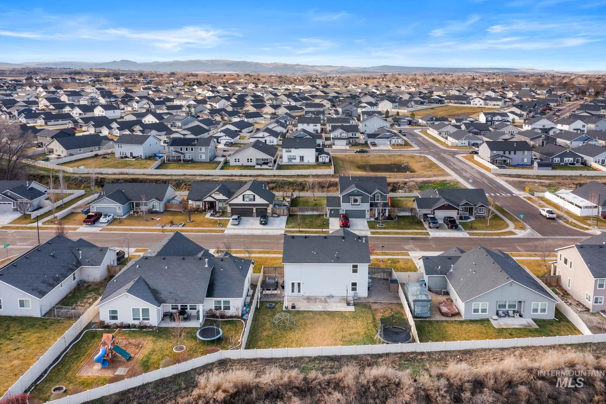 Aerial view of residential area with a mountain backdrop