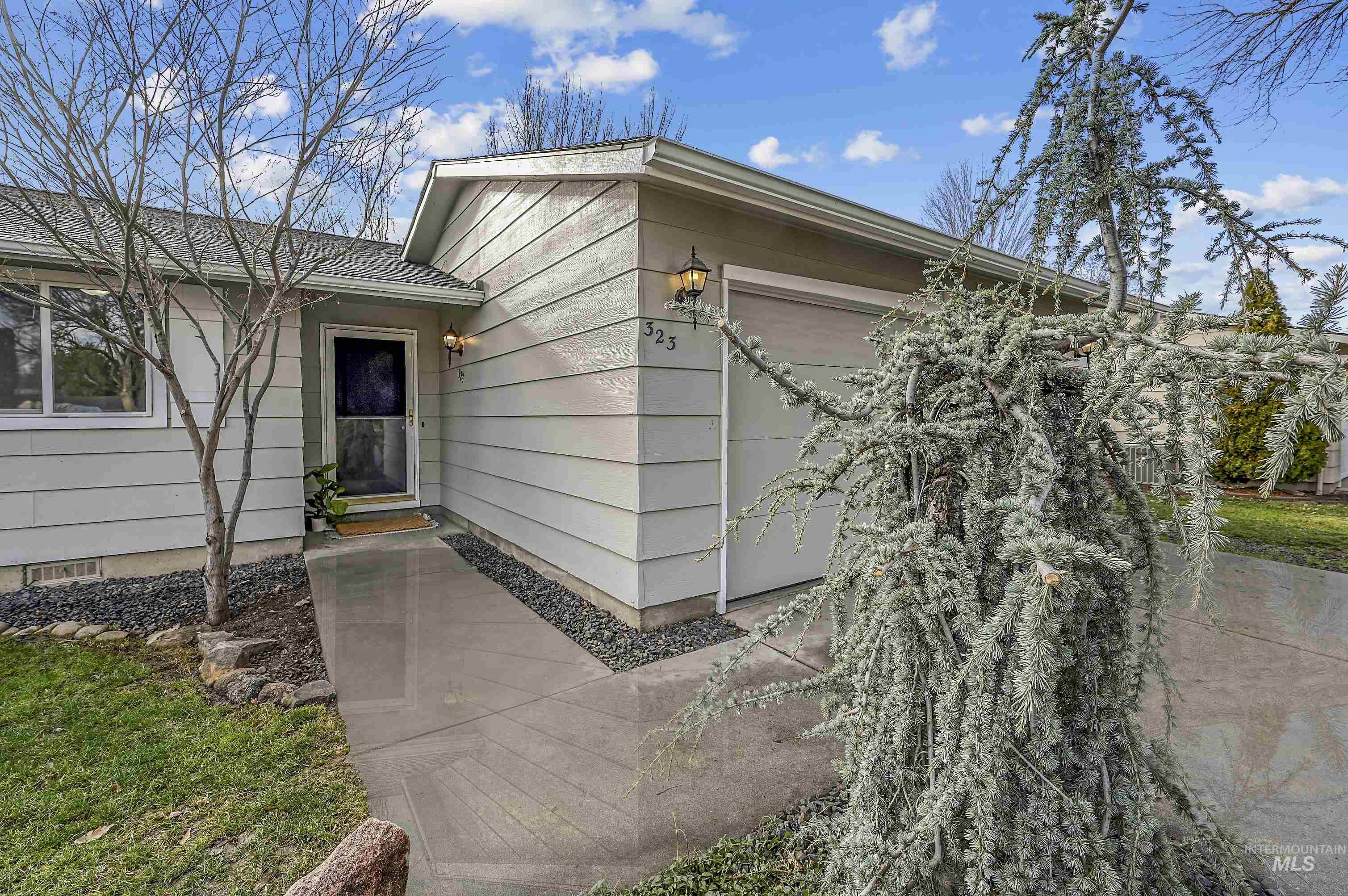View of exterior entry featuring a garage