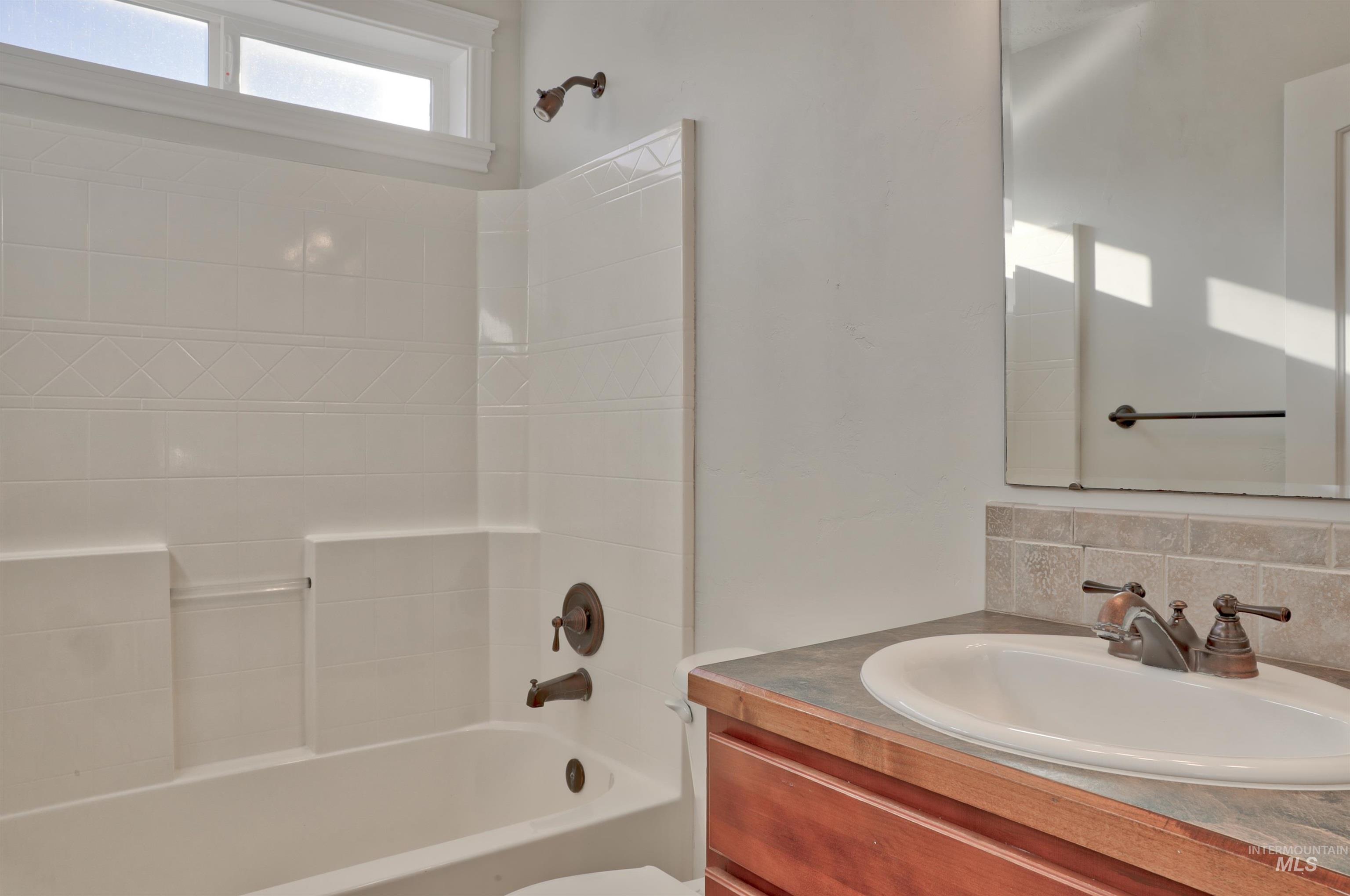 Full bathroom with vanity and shower / tub combination