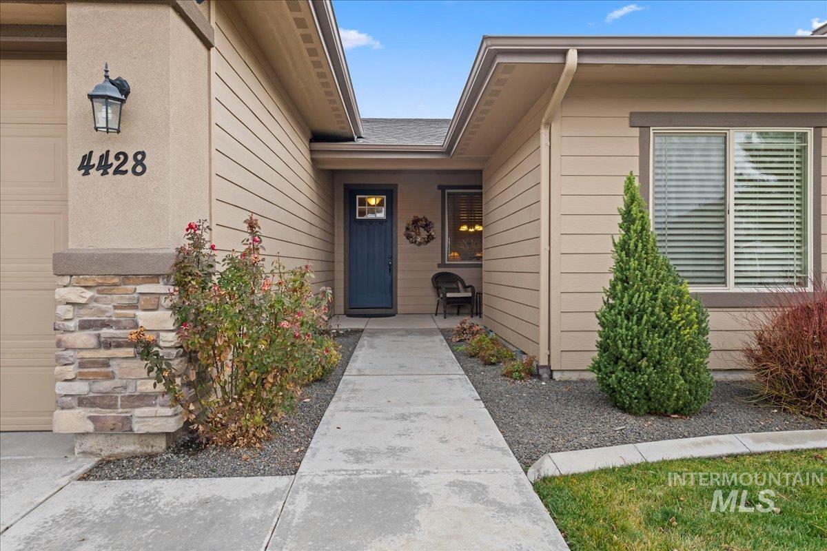 Doorway to property featuring a garage