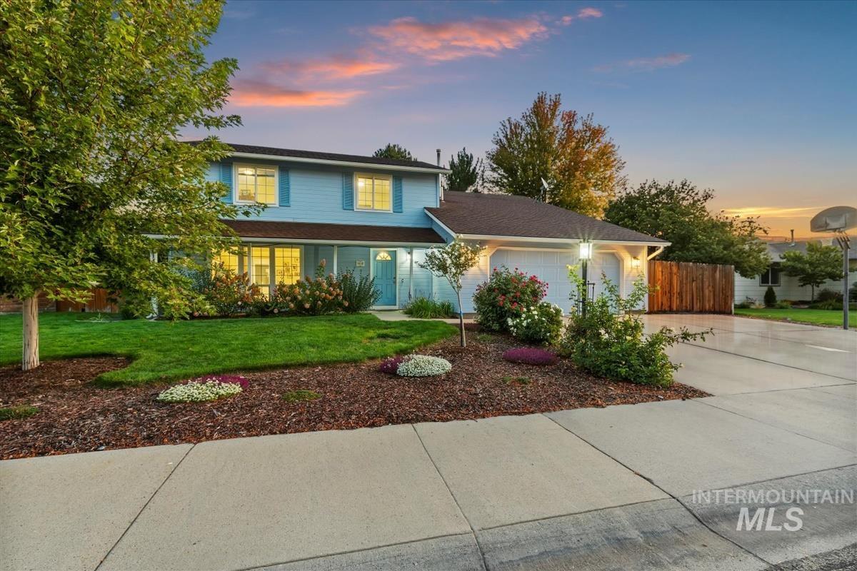 Traditional home with concrete driveway and a garage