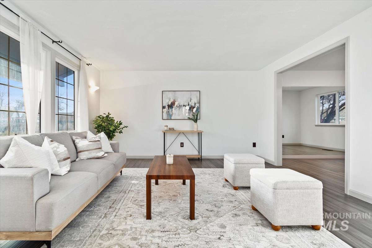 Living area featuring baseboards and wood finished floors