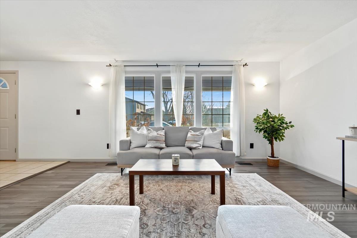 Living room featuring wood finished floors and baseboards