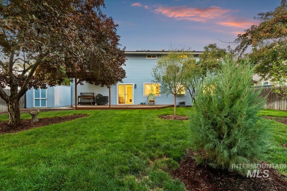 Rear view of house featuring a wooden deck
