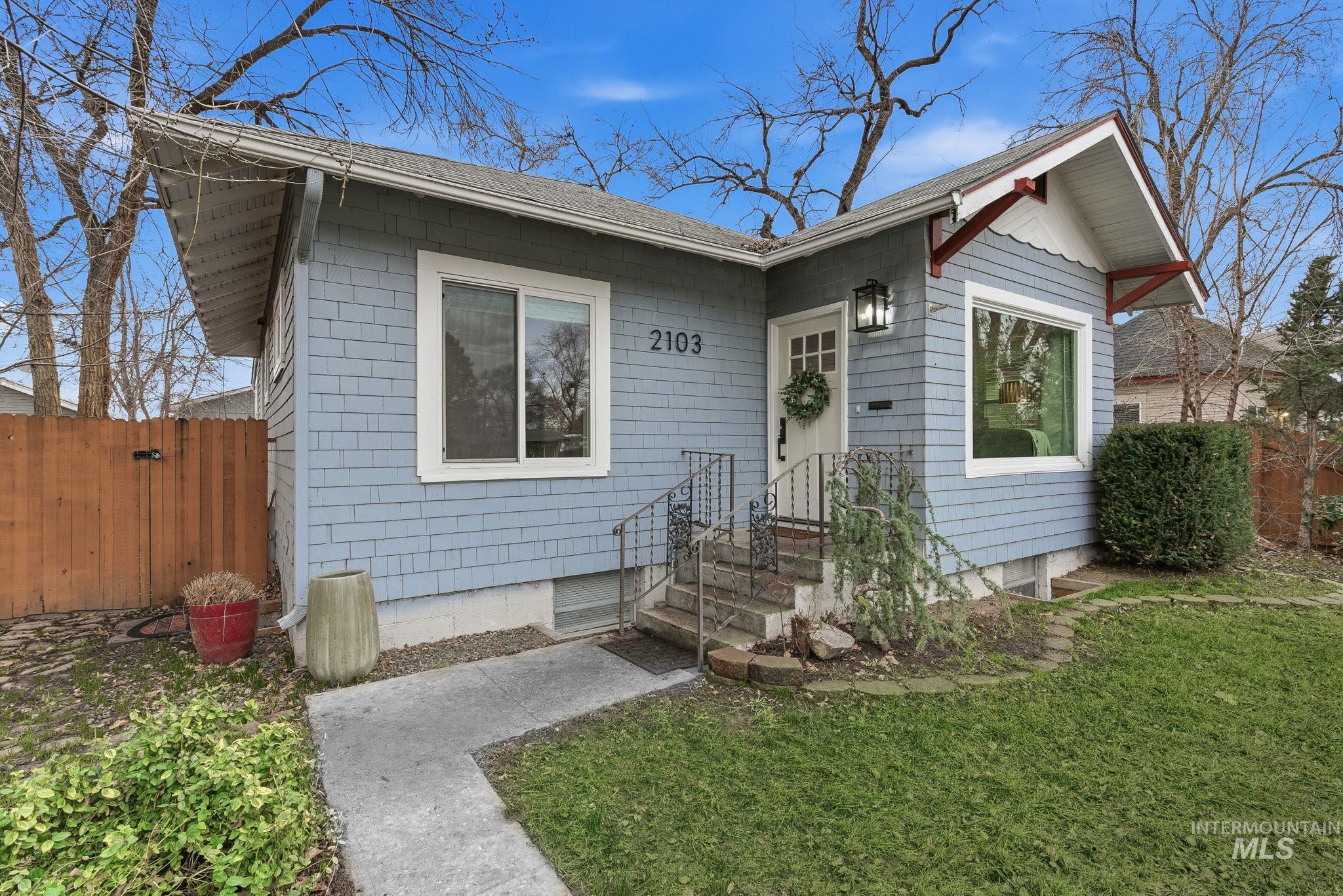 View of front of property featuring a shingled roof