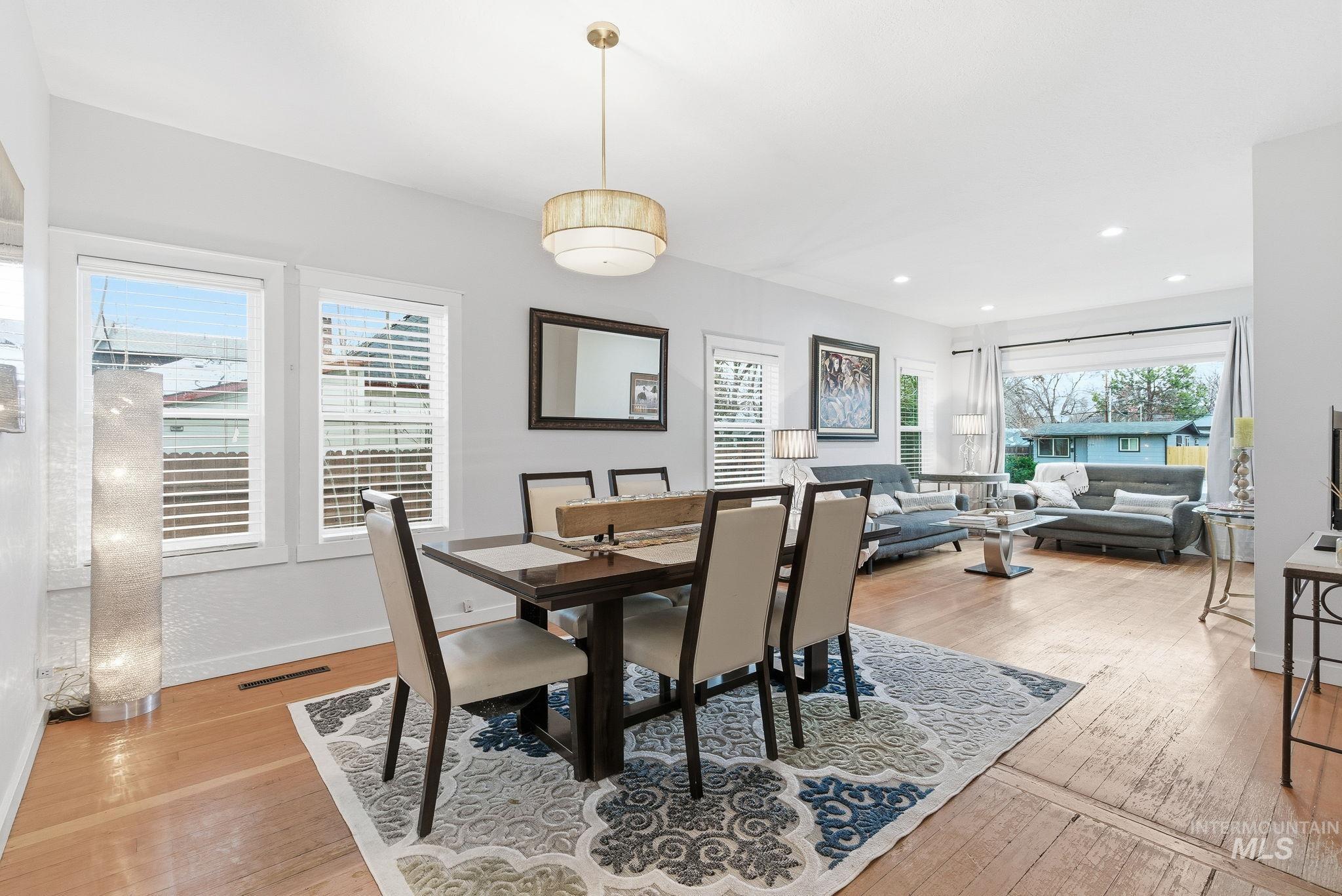 Dining area featuring plenty of natural light, light wood finished floors, and recessed lighting