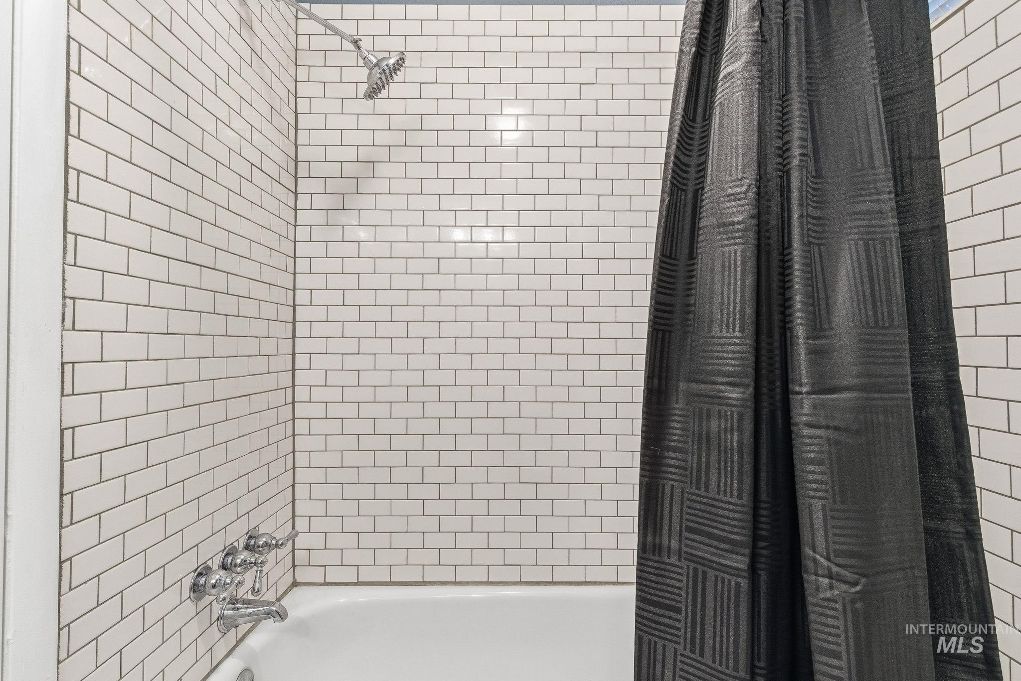 Full bathroom with shower / bath combo with shower curtain