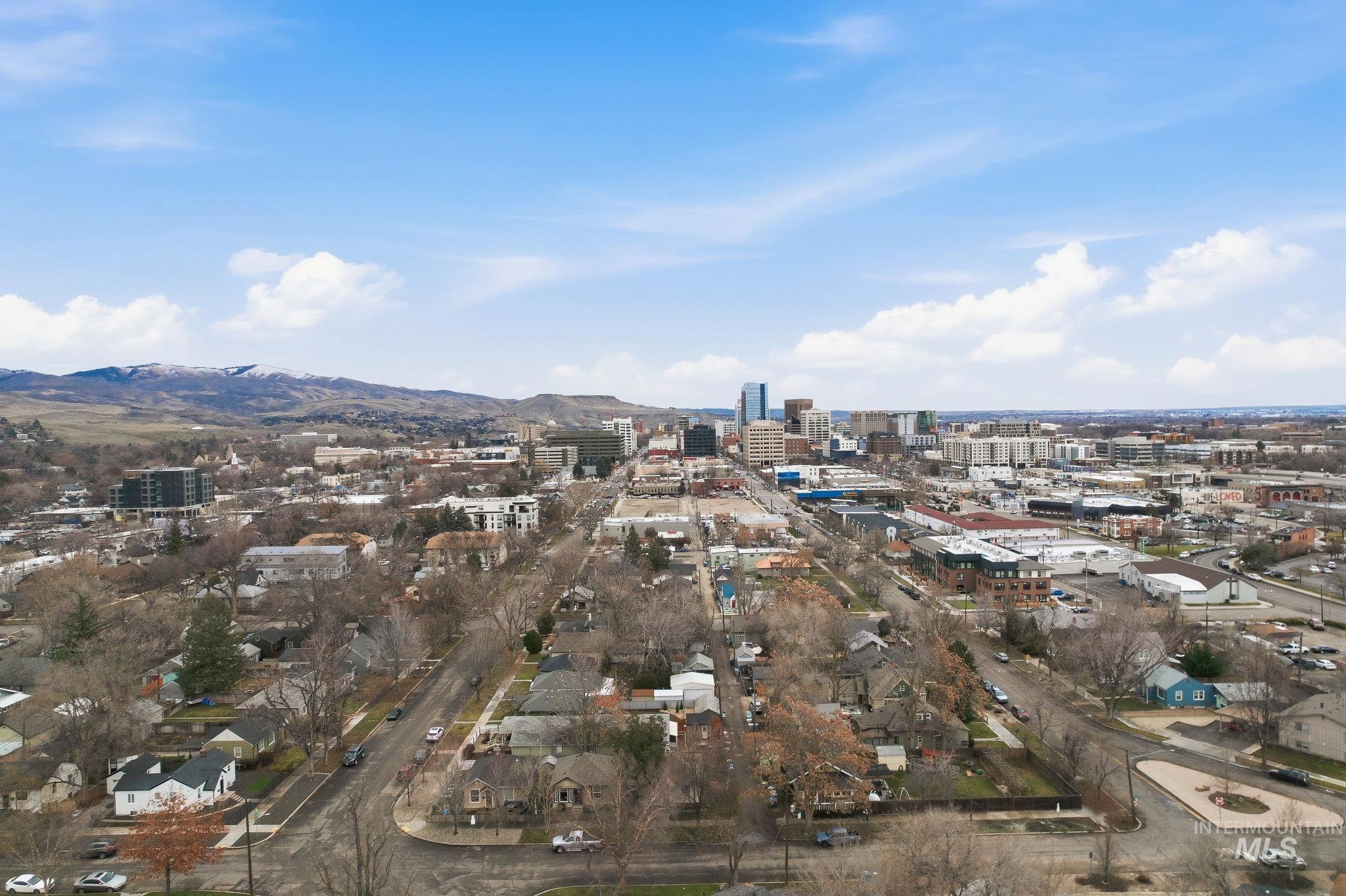 View of property location featuring nearby urban area and mountains