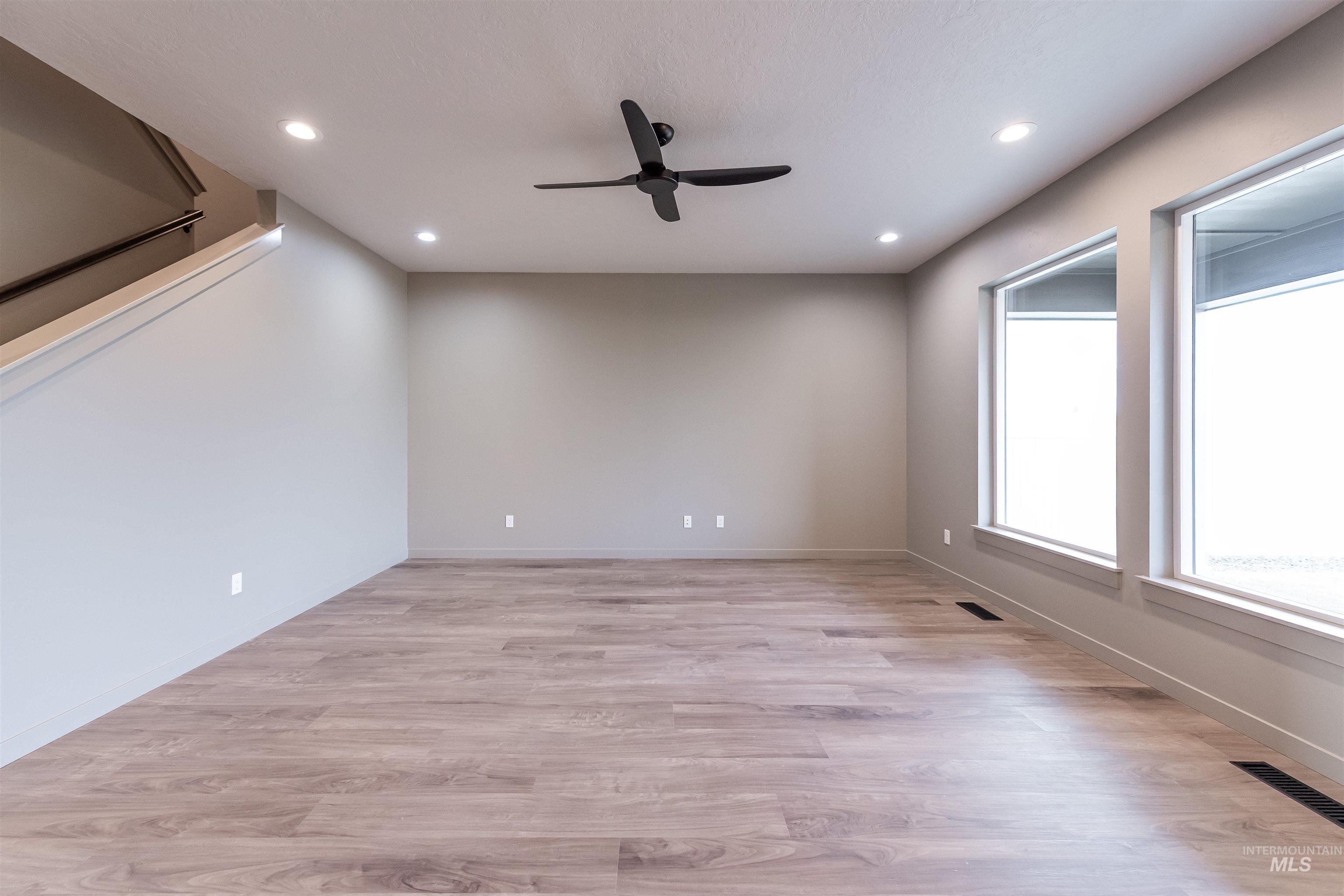 Unfurnished room featuring light wood-style flooring, recessed lighting, and ceiling fan