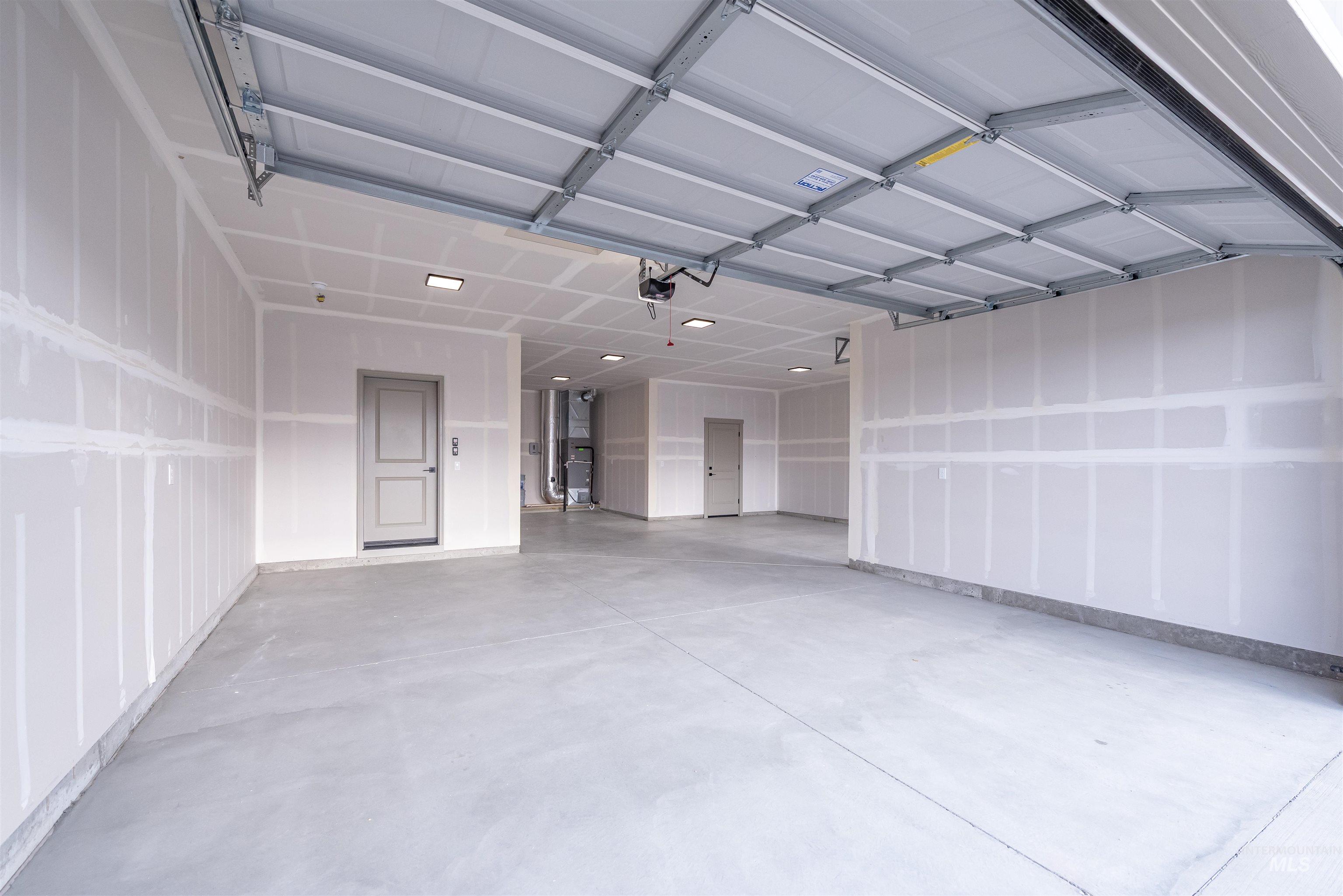 Garage featuring heating unit