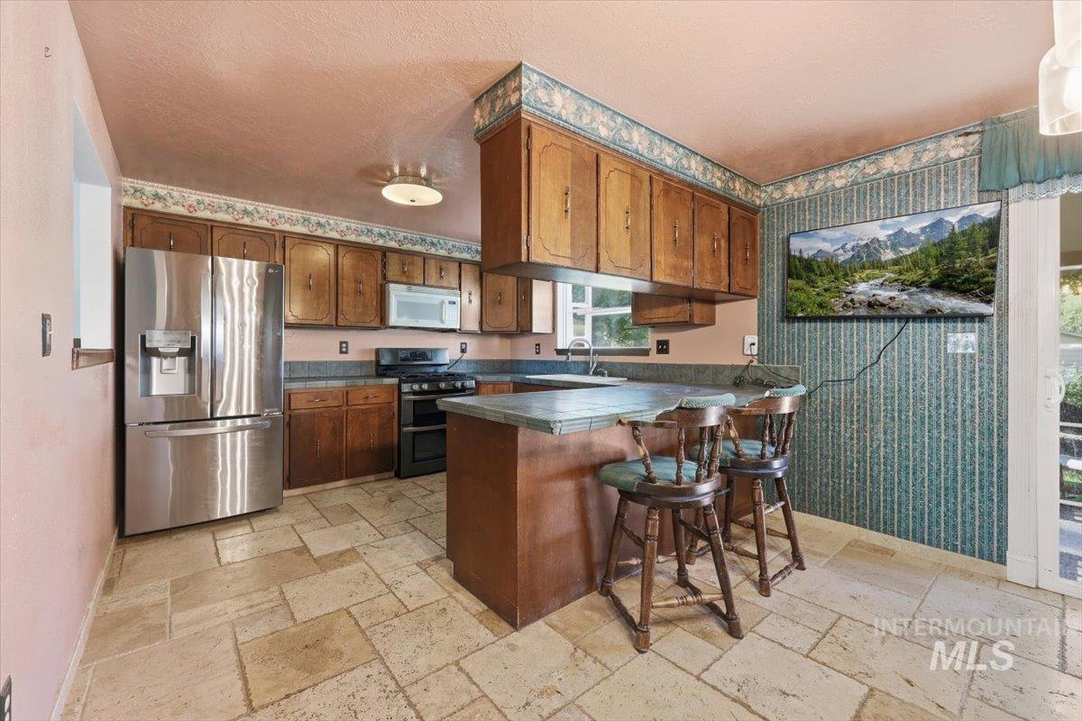 10883 W Reutzel Dr., Boise, Idaho 83709, 4 Bedrooms, 2 Bathrooms, Residential For Sale, Price $399,000,MLS 98984301