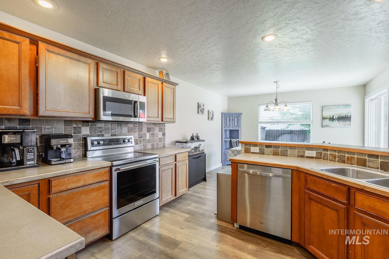 890 N Oxwich Ave, Meridian, Idaho 83642, 5 Bedrooms, 2.5 Bathrooms, Residential For Sale, Price $525,000,MLS 98992609